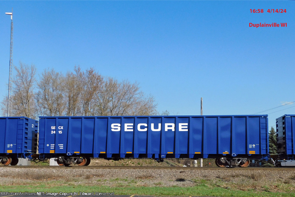 Seventeen new GE lease gondolas roll north on CN - wonder what SECURE is